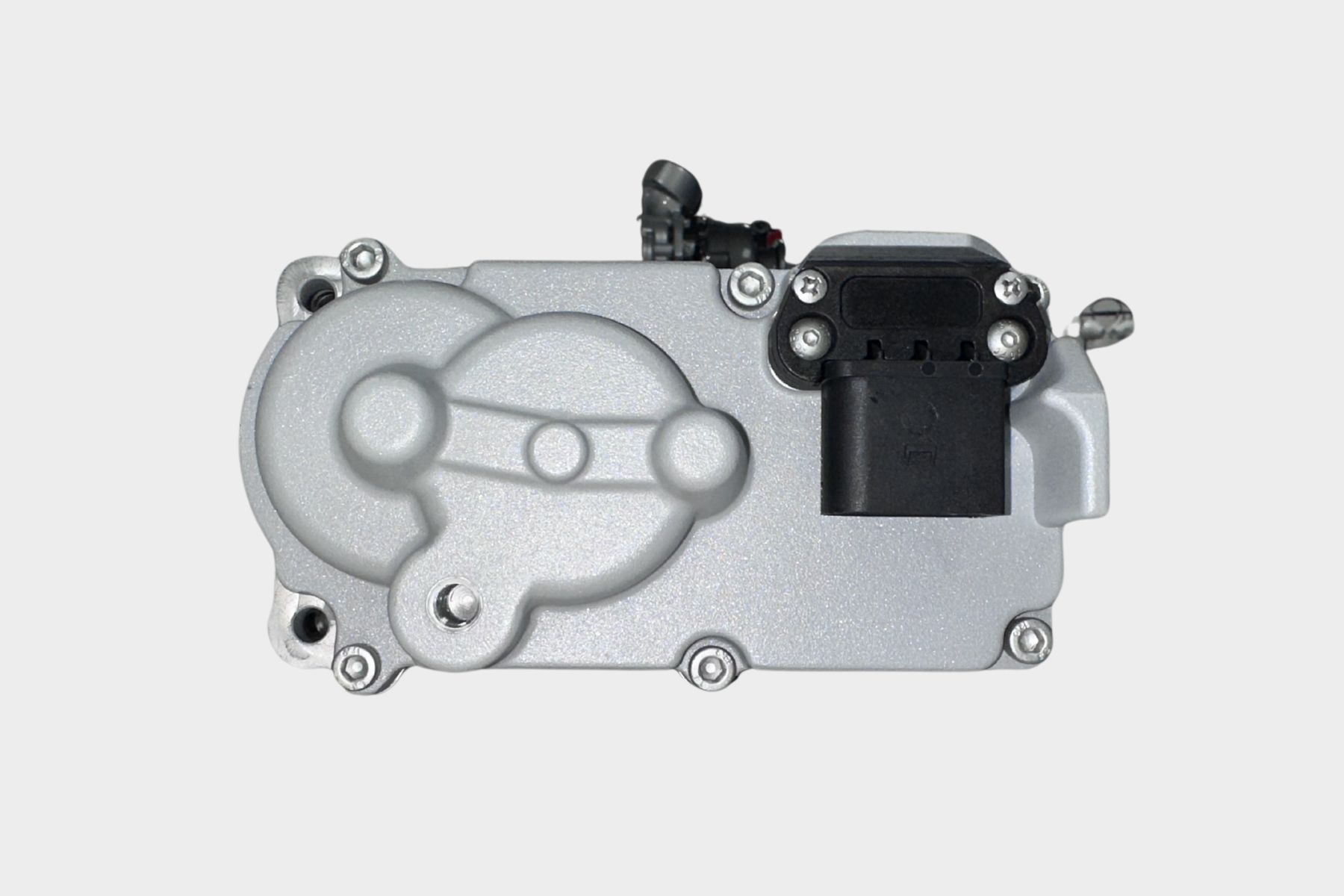 A close-up view of the 300143001JT Just Turbo Turbocharger Actuator featuring a silver metal casing with visible screws, connectors, and embossed circular patterns.