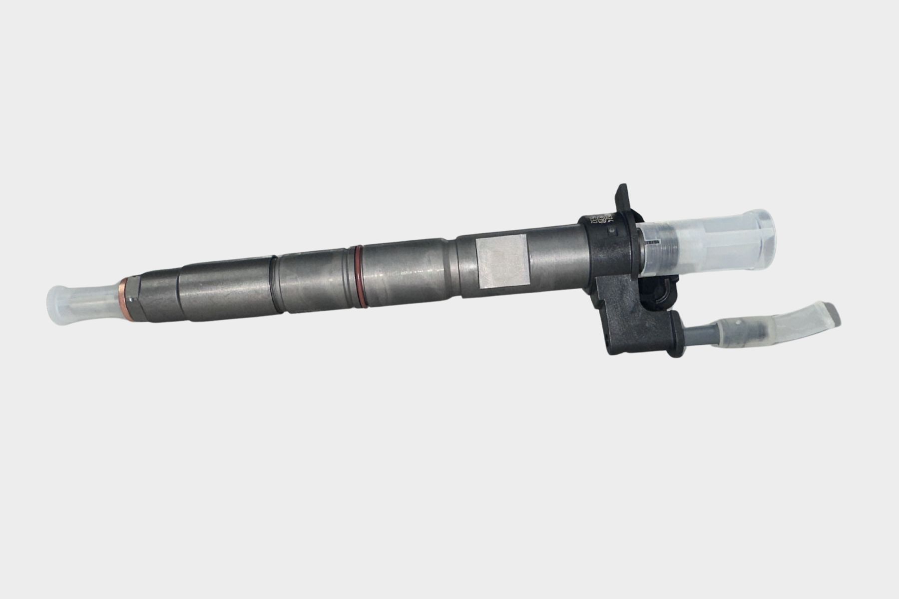 Close-up of a Bosch 0986435410 LML Common Rail Injector featuring a metallic body, plastic connectors, and nozzle, isolated on a white background.
